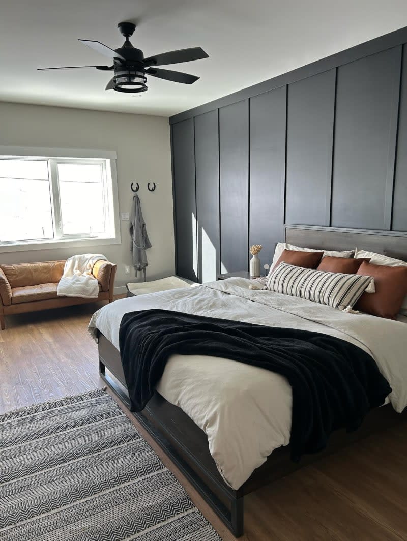 Bedroom with one large charcoal accent wall