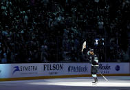 Seattle Kraken center Yanni Gourde (37) prepares to throw a stuffed fish into the crowd while celebrating a win over the Dallas Stars in Game 6 of an NHL hockey Stanley Cup second-round playoff series Saturday, May 13, 2023, in Seattle. (AP Photo/Lindsey Wasson)