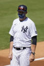 New York Yankees' Manager Aaron Boone stands on the field before a spring baseball game against the Toronto Blue Jays Sunday, Feb. 28, 2021, in Tampa, Fla. (AP Photo/Frank Franklin II)