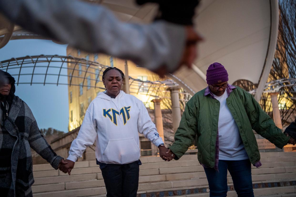 Teresa Mosely leads a prayer vigil for peace at Pack Square Park, February 2, 2024. Mosely’s son, Keith, was shot and killed at Hillcrest Apartments while picking up his girlfriend to go swimming on Memorial Day Weekend in 2022.