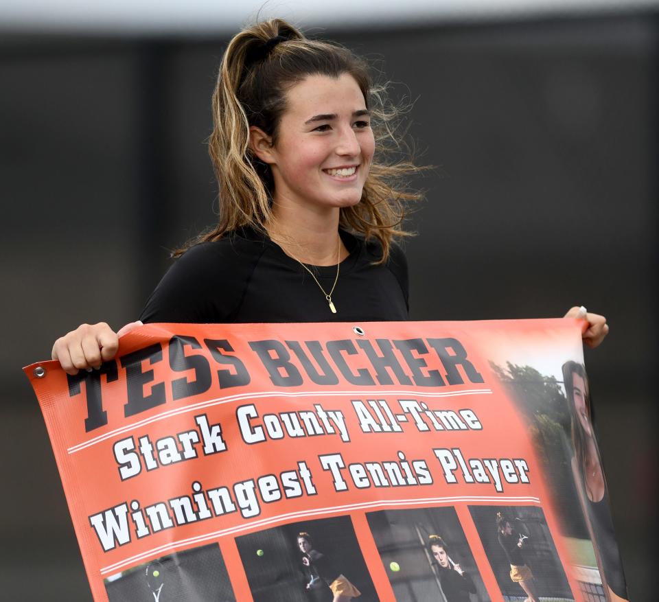 Hoover senior Tess Bucher is honored by her team after defeating Haylee Fearon of Perry in the girls tennis Division I sectional final to become Stark County's all-time winningest player, Saturday, Oct. 7, 2023, at Jackson Park Courts.