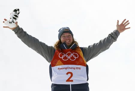 Freestyle Skiing - Pyeongchang 2018 Winter Olympics - Men's Ski Halfpipe Finals - Phoenix Snow Park - Pyeongchang, South Korea - February 22, 2018 - Gold medallist David Wise of the U.S. holding a Soohorang mascot plush doll celebrates his victory during the flower ceremony. REUTERS/Issei Kato