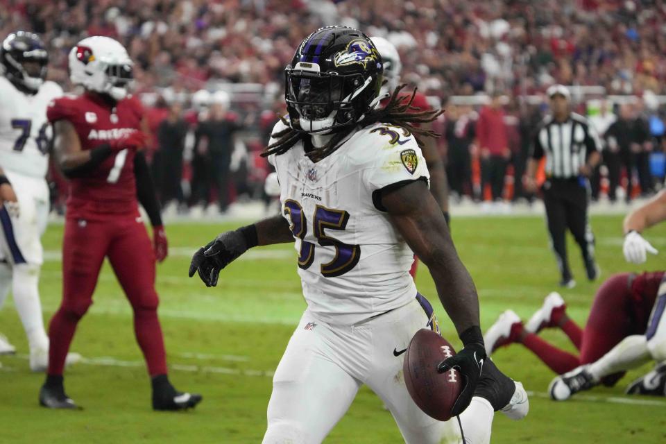 Baltimore Ravens running back Gus Edwards celebrates his touchdown during the second half of an NFL football game against the Arizona Cardinals Sunday, Oct. 29, 2023, in Glendale, Ariz. (AP Photo/Rick Scuteri)