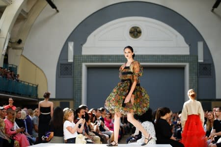 Models present creations during the Molly Goddard catwalk show during London Fashion Week in London