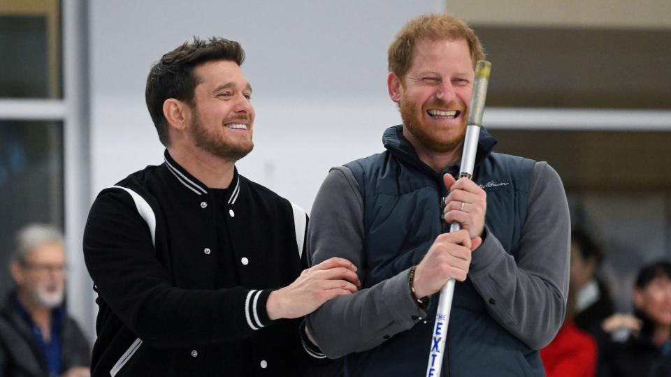 Michael Buble and Prince Harry laughing