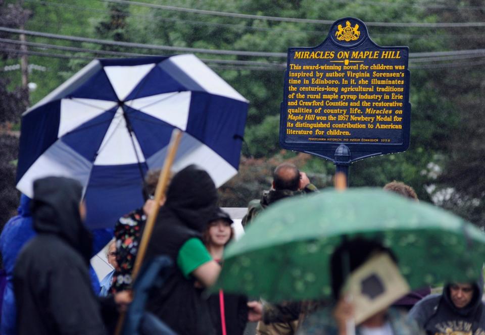 Officials from the Pennsylvania Historical and Museum Commission, Edinboro Area Historical Society, and Hurry Hill Maple Farm Museum Association present an official Pennsylvania Historical Marker in 2015 honoring Edinboro author Virginia Sorenson and the region's maple industry at the Edinboro Branch Library. Sorenson's book, "Miracles on Maple Hill," won a Newbery Medal Award for children's literature in 1957.