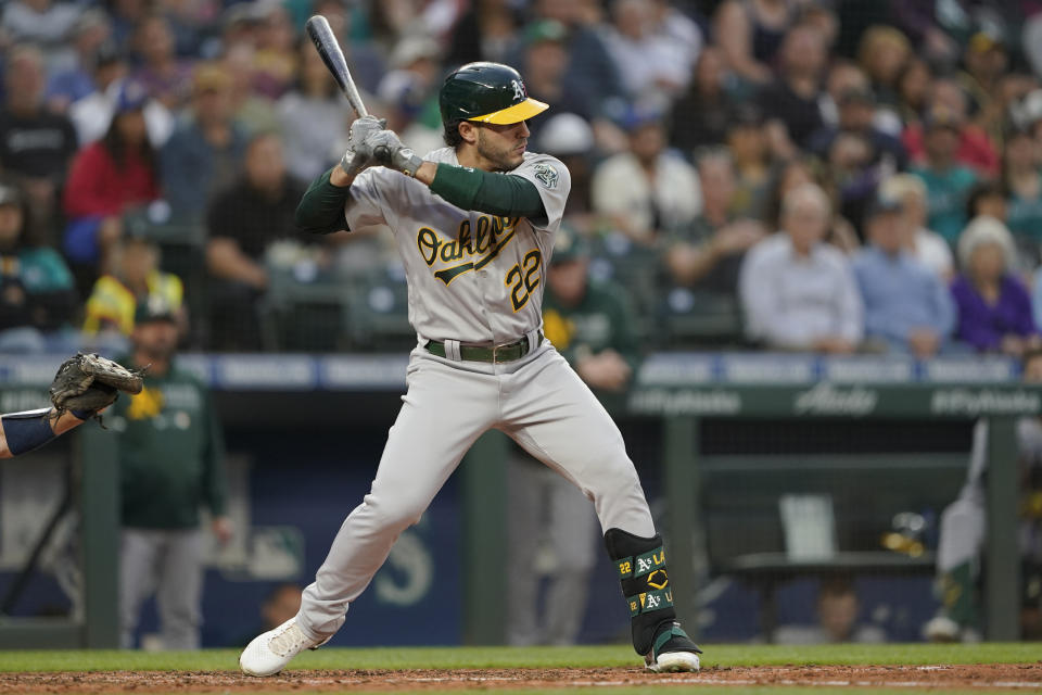 Oakland Athletics' Ramon Laureano begins his swing on an RBI-single to score Elvis Andrus during the fifth inning of a baseball game against the Seattle Mariners, Thursday, July 22, 2021, in Seattle. (AP Photo/Ted S. Warren)