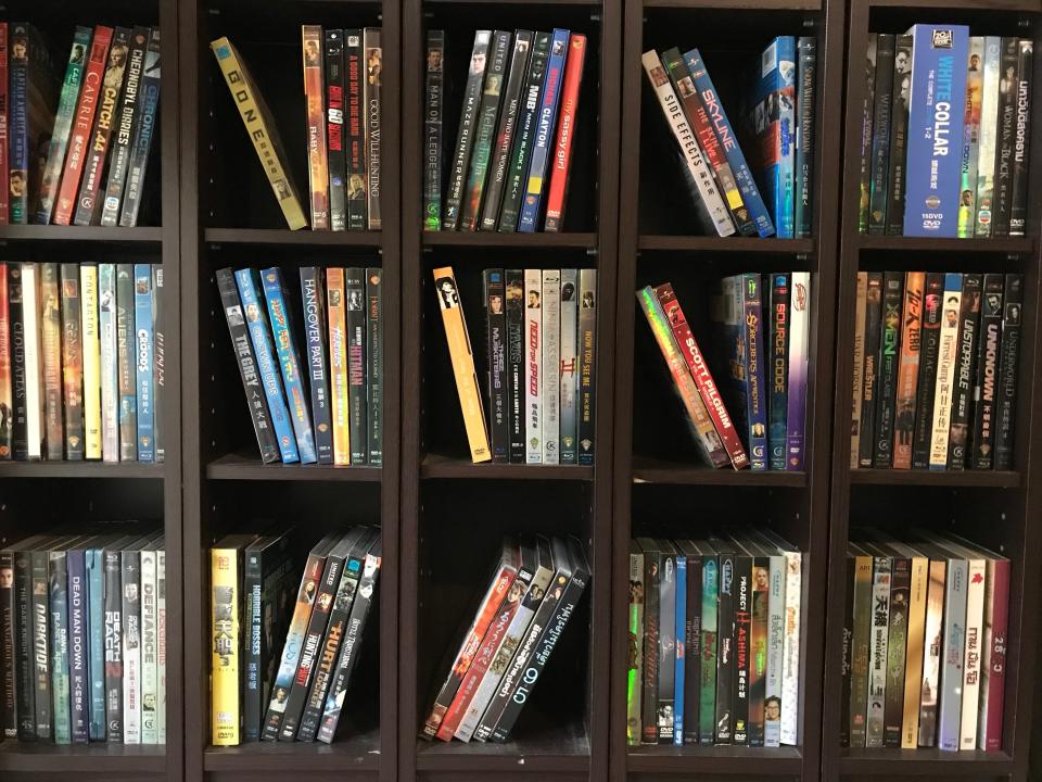 Black shelves filled with DVDs