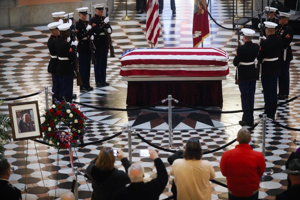 Marines stand guard at the casket of John Glenn as he lies in honor, Friday, Dec. 16, 2016, in Columbus, Ohio. Glenn's home state and the nation began saying goodbye to the famed astronaut who died last week at the age of 95. (AP Photo/John Minchillo)