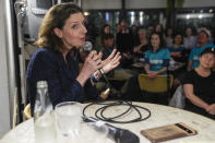 Independent candidate for the inner city seat of Wentworth, Allegra Spender, gestures during a public forum ahead of next weekend's general election in Sydney, Australia on May 16, 2022. Sydney businesswoman Spender has an impeccable pedigree for a career in Australian politics. She is the daughter of a conservative federal lawmaker and granddaughter of a conservative cabinet minister. More surprising than her decision to run for office, she has chosen to become a candidate of a breakaway political grouping that has emerged as a threat to the ruling conservative Liberal Party. (AP Photo/Mark Baker)