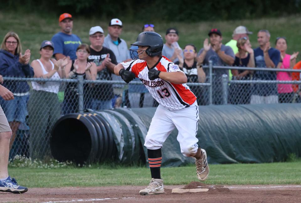 Middleboro's Ayden Morris flexes his muscles after hitting a triple to drive in runs during a game versus Barnstable at Field of Dreams in Middleboro on Wednesday, July 6, 2022.