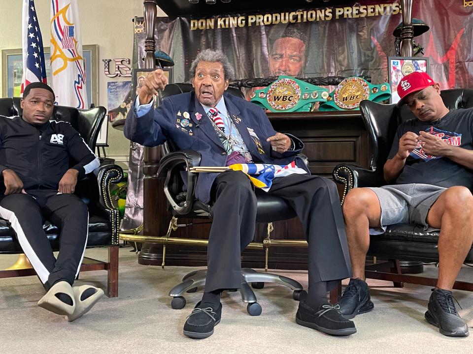 Boxing promoter Don King (center) discusses his upcoming card at his Deerfield Beach office while flanked by Adrien Broner (left), who headlines the card and trainer Kevin Cunningham.