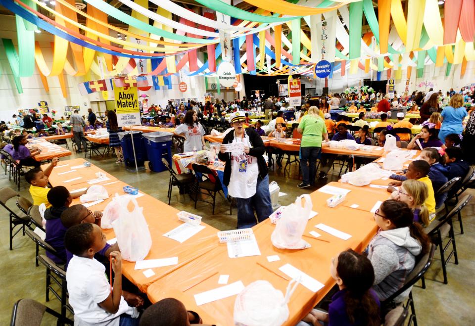 Tracy McComic works with kids on an art project during ArtBreak Wednesday afternoon, April 24, 2019 at the Shreveport Convention Center.