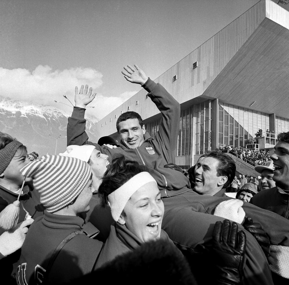 FILE - Terry McDermott, 23, who won the first gold medal for the U.S. in the ninth Winter Olympic games, is hoisted to the shoulders of teammates after his triumph at Innsbruck, Feb. 4, 1964. McDermott, who won the only gold medal for the United States at the 1964 Winter Olympics, died on Saturday, May 20, 2023, U.S. Speedskating said. He was 82. (AP Photo/Hans Von Nolde, File)