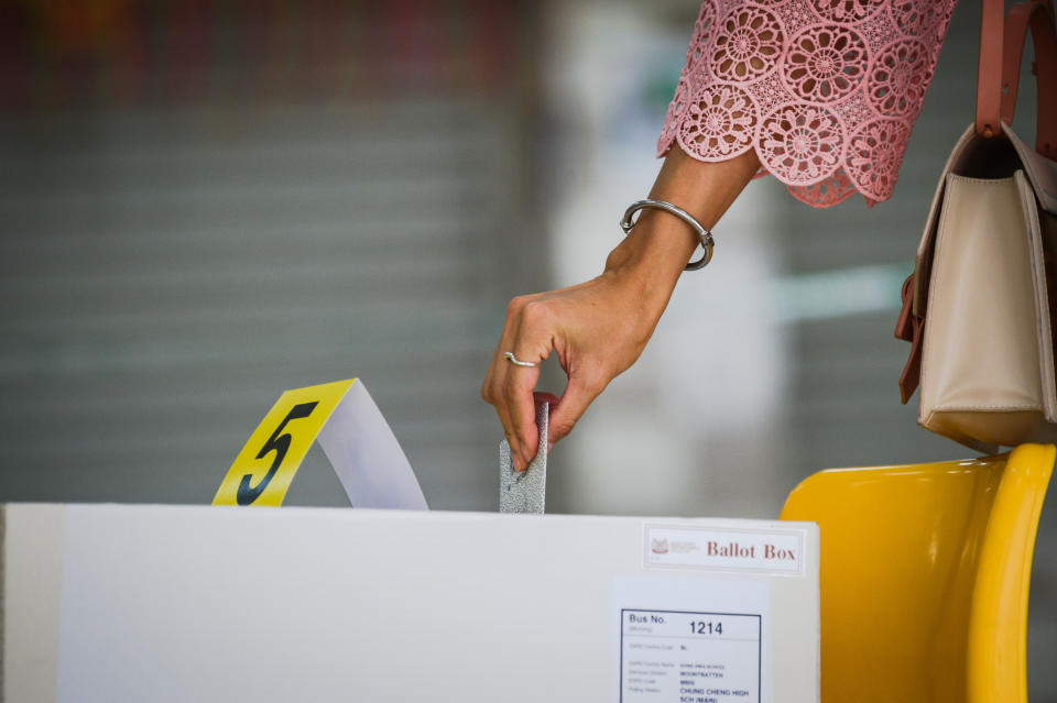 A woman casting her vote at the Chung Cheng High School polling centre on 10 July. (PHOTO: Joseph Nair for Yahoo News Singapore)