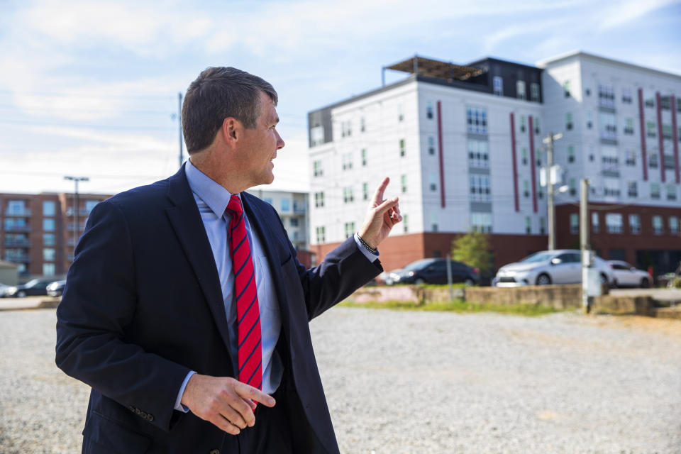 Tuscaloosa Mayor Walt Maddox talks about the off-campus student housing in the background that is seeing growth Wednesday, Oct. 13, 2021, in Tuscaloosa, Ala. College communities such as Tuscaloosa are exploring their options for contesting the results of the 2020 census, which they say do not accurately reflect how many people live there. Maddox believes thousands of off-campus students were overlooked, and the city plans to challenge the numbers. (AP Photo/Vasha Hunt)