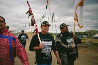 <p>Fort Mojave Tribal Counsel members Johnny Hemmers, at right, and Timothy Williams return to camp after standing at the Dakota Access Pipeline protest site on Tuesday, Sept. 6, 2016. (Photo: Alyssa Schukar for Yahoo News) </p>