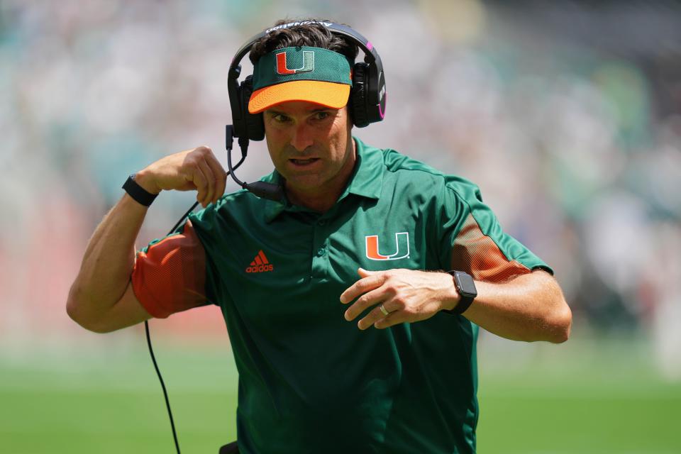 Sep 18, 2021; Miami Gardens, Florida, USA; Miami Hurricanes head coach Manny Diaz walks on the sideline during the first half against the Michigan State Spartans at Hard Rock Stadium. Mandatory Credit: Jasen Vinlove-USA TODAY Sports