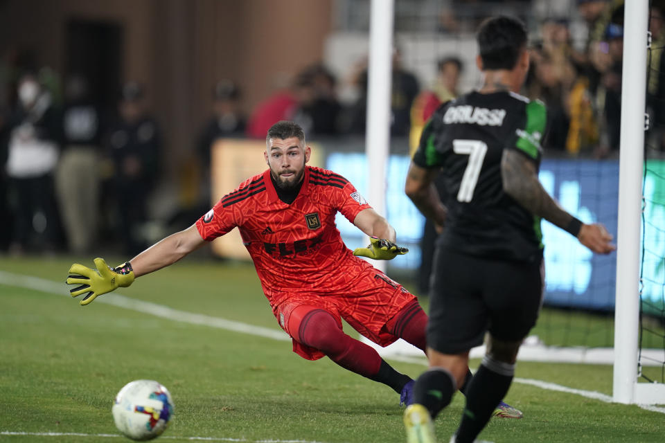 Los Angeles FC goalkeeper Maxime Crépeau (16) stops a shot by Austin FC forward Sebastián Driussi (7) during the first half of an MLS soccer match in Los Angeles, Wednesday, May 18, 2022. (AP Photo/Ashley Landis)