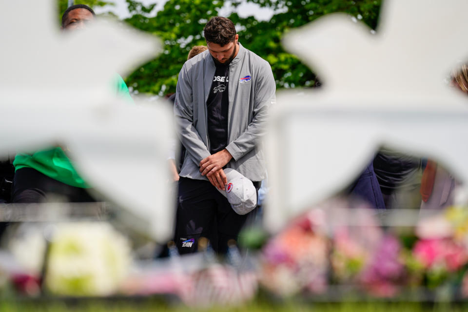 Buffalo Bills' Josh Allen visits the scene of Saturday's shooting at a supermarket, in Buffalo, N.Y., Wednesday, May 18, 2022. (AP Photo/Matt Rourke)