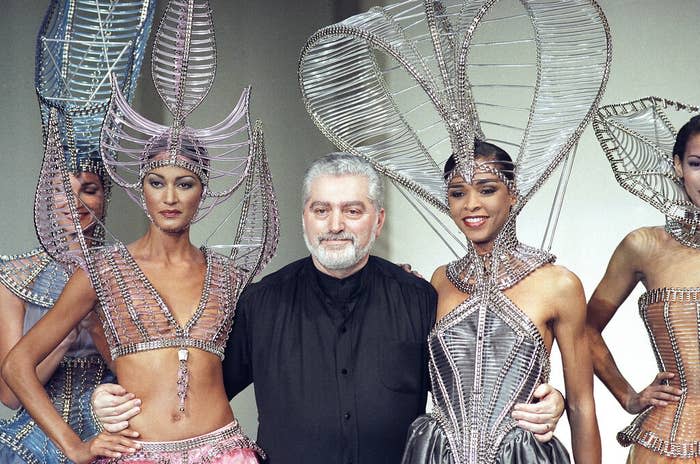 Paco Rabanne embraces models after the presentation of his spring/summer collection on Jan. 27, 1993, in Paris.