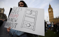 <p>A demonstrator holds a placard during a protest against U.S. President Donald Trump in London, Feb. 20, 2017. (Photo: Toby Melville/Reuters) </p>