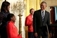 U.S. President Barack Obama jokes with 2016 Olympic individual all-around gymnast Simone Arianne Biles as he welcomes U.S. Olympic and Paralympics teams at the White House in Washington, U.S., September 29, 2016. REUTERS/Yuri Gripas