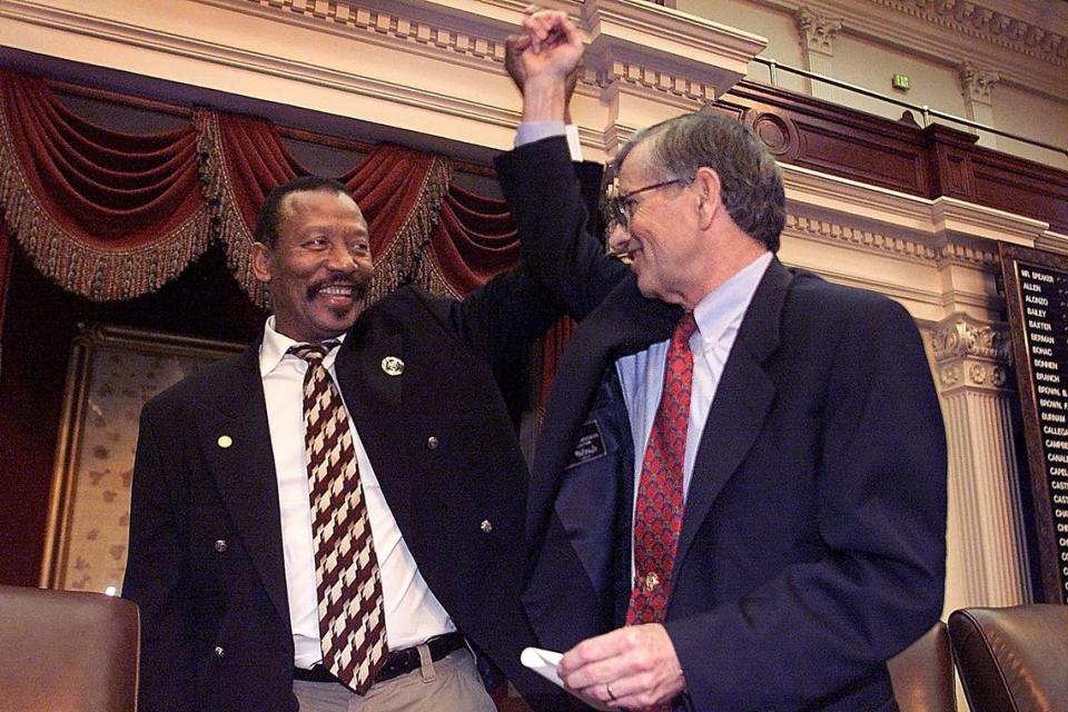 Rep. Al Edwards, D-Houston, (left) with House Speaker Tom Craddick in 2003. (file photo)