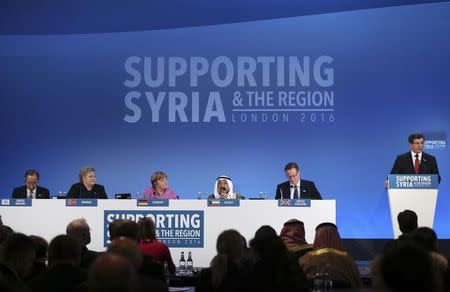 United Nations Secretary-General Ban Ki-moon, Norway's Prime Minister Erna Solberg, German Chancellor Angela Merkel, the Emir of Kuwait, Sheikh Sabah al-Ahmad al-Sabah and Britain's Prime Minister David Cameron (L-R) listen as Turkish Prime Minister Ahmet Davutoglu speaks at the donors Conference for Syria in London, Britain February 4, 2016. REUTERS/Dan Kitwood/pool