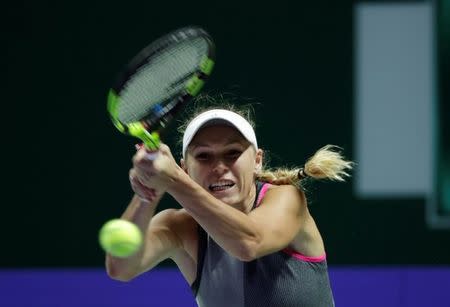 Tennis - WTA Tour Finals - Singapore Indoor Stadium, Singapore - October 23, 2017 Denmark's Caroline Wozniacki in action during her group stage match with Ukraine's Elina Svitolina REUTERS/Jeremy Lee