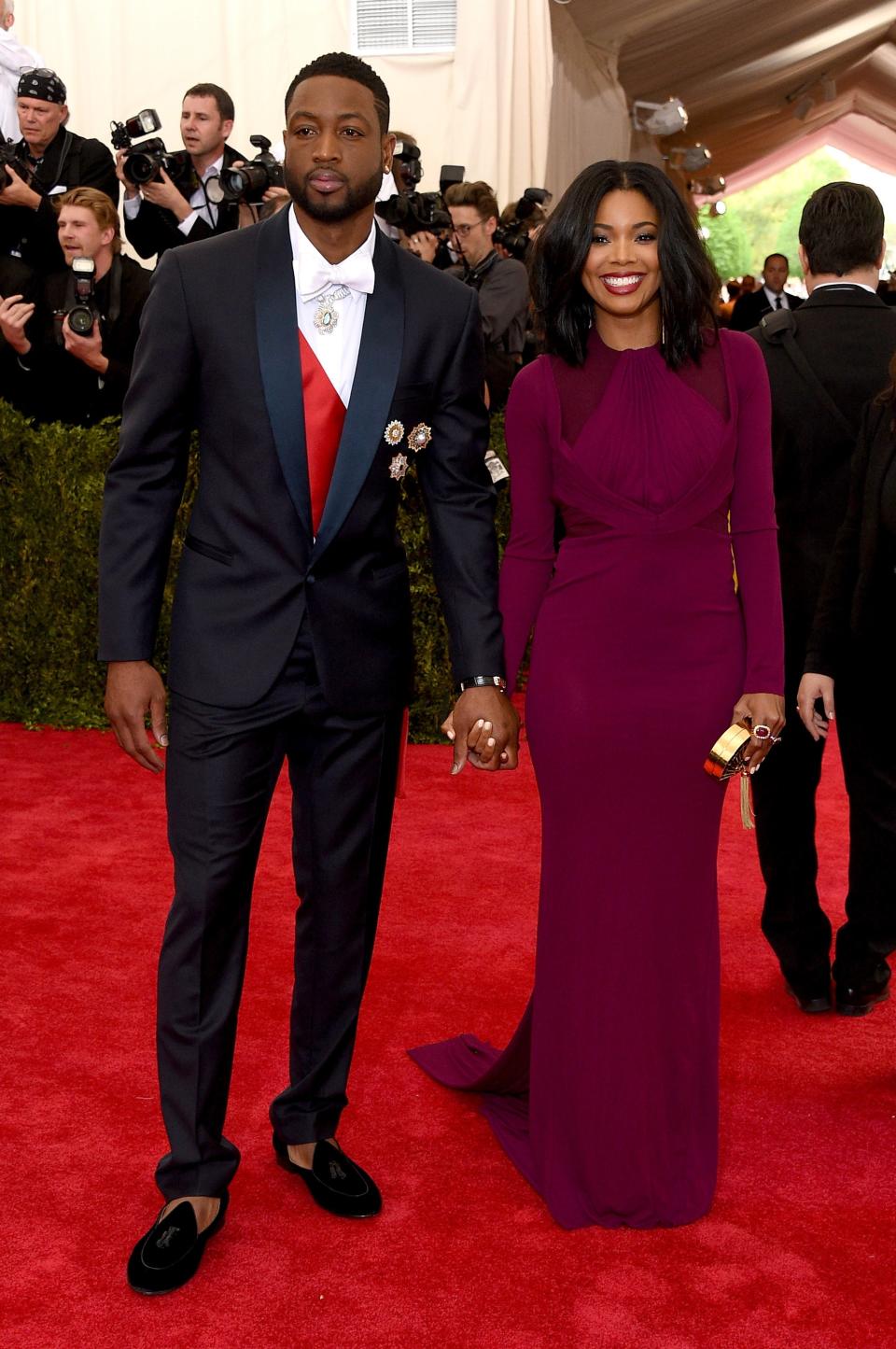 <h1 class="title">Dwyane Wade in a Versace suit and Buccellati jewelry and Gabrielle Union in a Zac Posen dress and Charlotte Olympia bag</h1><cite class="credit">Photo: Getty Images</cite>