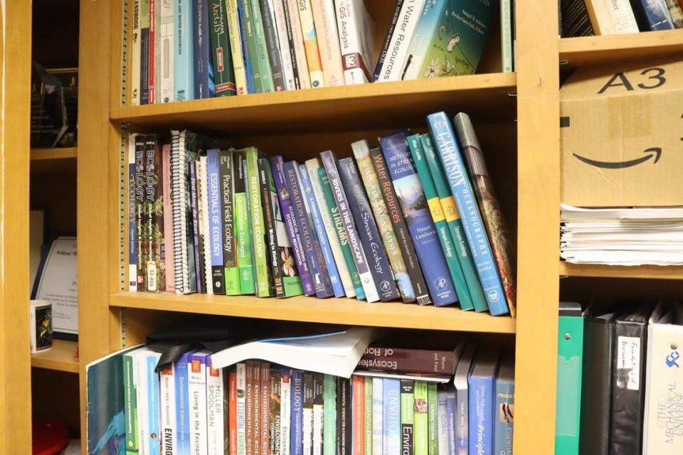 Environmental science books along Troy Keller’s wall in his office at Columbus State University.