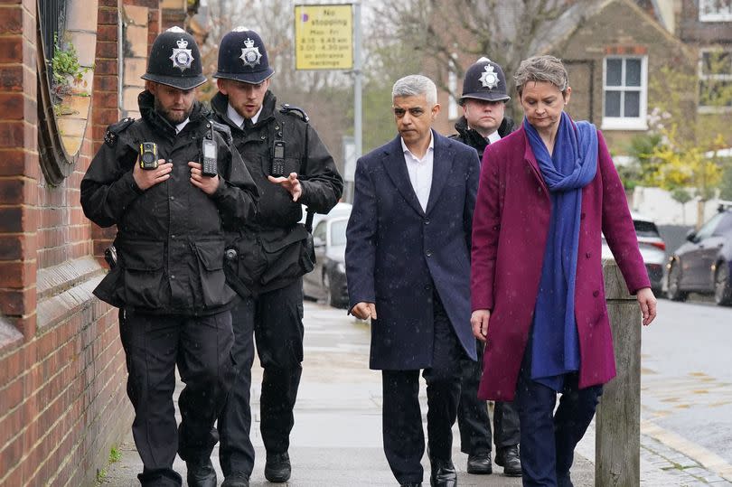 Mayor of London Sadiq Khan and shadow home secretary Yvette Cooper during a walkabout with police officers