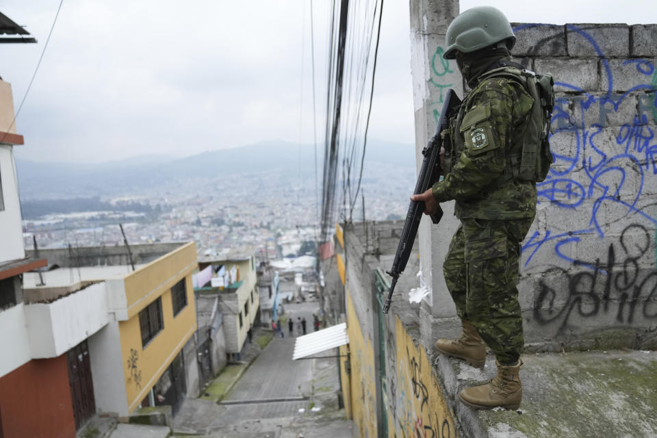Soldiers patrol a residential area on the south side of Quito, Ecuador, Friday, Jan. 12, 2024, in the wake of the apparent escape of a powerful gang leader from prison. President Daniel Noboa decreed Monday a national state of emergency, a measure that lets authorities suspend people’s rights and mobilize the military. (AP Photo/Dolores Ochoa)