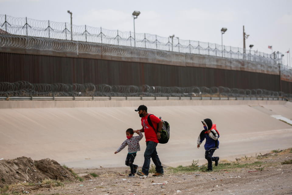 Migrants are seen in Ciudad Juarez, Mexico before crossing the Rio Bravo river to turn themselves in to U.S. Border Patrol agents to request for asylum in El Paso, Texas on March 22, 2021. (Jose Luis Gonzalez/Reuters)
