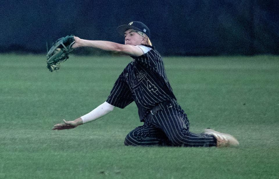 George Jenkins right fielder Austin Dadey makes a sliding catch against Ocala Forest in the second inning on Tuesday in the 6A-2 regional quarterfinals.
