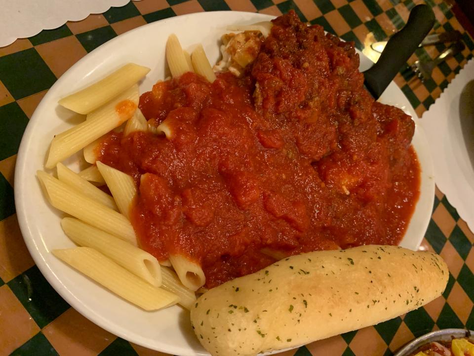 The Italian sampler with lasagna, a stuffed shell, meatball and rigatoni with meat sauce at Angie's Italian Restaurant in Barberton.