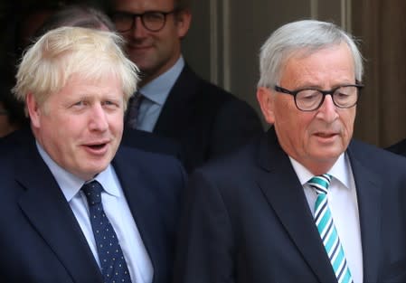 British Prime Minister Boris Johnson and European Commission President Jean-Claude Juncker leave after their meeting in Luxembourg