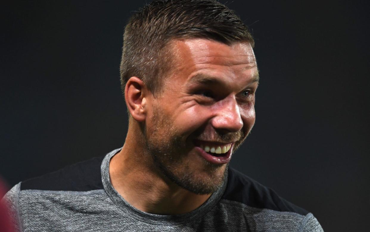 An image of German footballer Lukas Podolski was used to illustrate a story about a migrant smuggling operation from Morocco to Spain - Getty Images AsiaPac