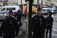 Police investigate activity they deem suspicious near the Seine River, during the 2024 Summer Olympics, Saturday, July 27, 2024, in Paris, France. (AP Photo/Rebecca Blackwell)