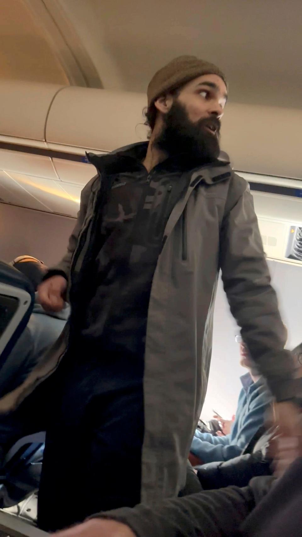 A still image from a video allegedly shows Francisco Severo Torres as he moves through the cabin on a weekend flight from Los Angeles to Boston on March 5.