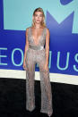 <p>Hailey Baldwin wore a silver and sheer jumpsuit. (Photo: Getty Images) </p>