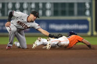 Houston Astros' Jose Siri, right, is tagged out by Arizona Diamondbacks shortstop Nick Ahmed while trying to steal second base during the eighth inning of a baseball game Friday, Sept. 17, 2021, in Houston. (AP Photo/David J. Phillip)