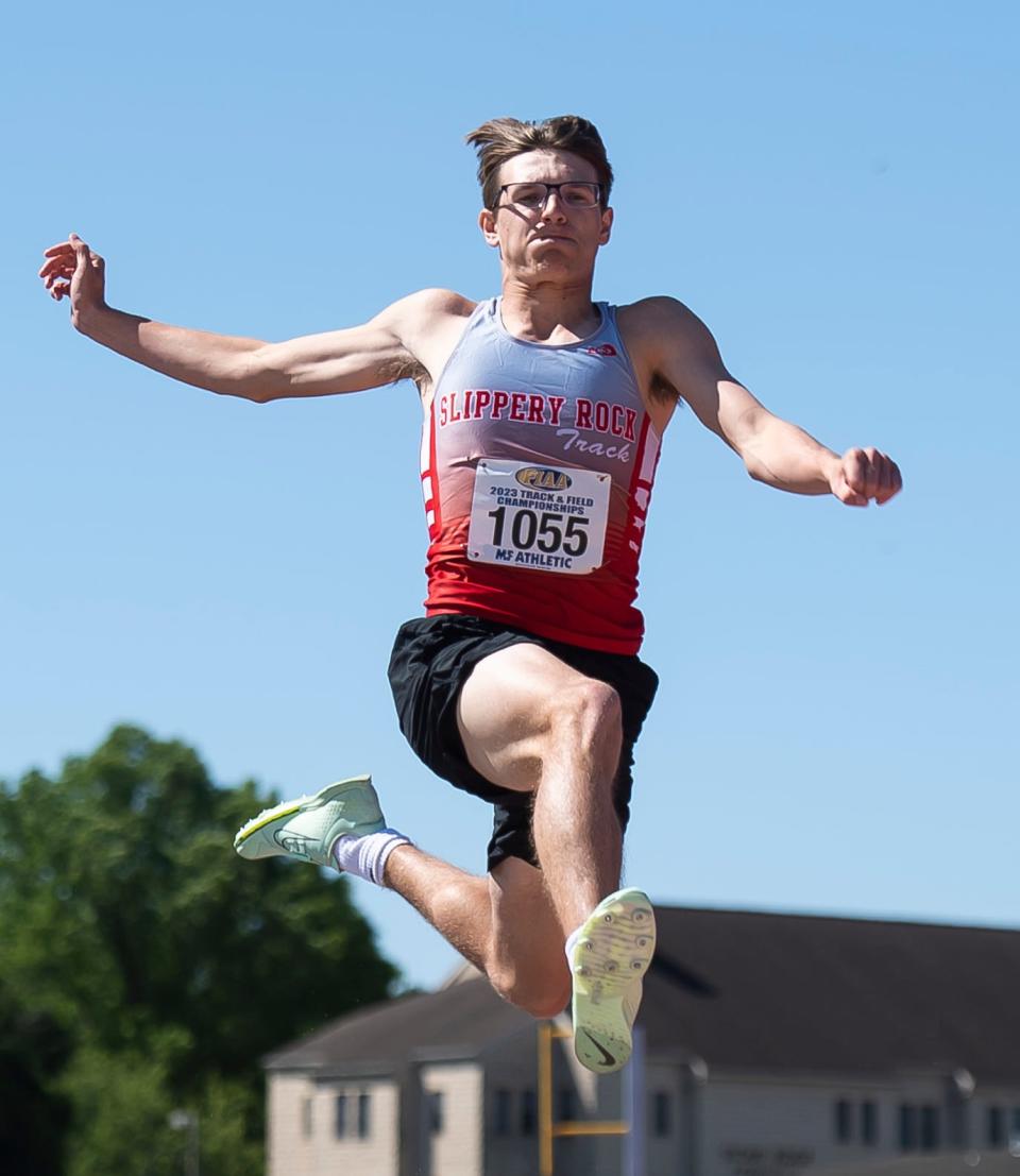 Slippery Rock's Levi Prementine flies through the air on his way to a gold medal in the 2A long jump at the PIAA track and field championships at Shippensburg University on Friday. Prementine won with a mark of 23 feet 1¼ inches.