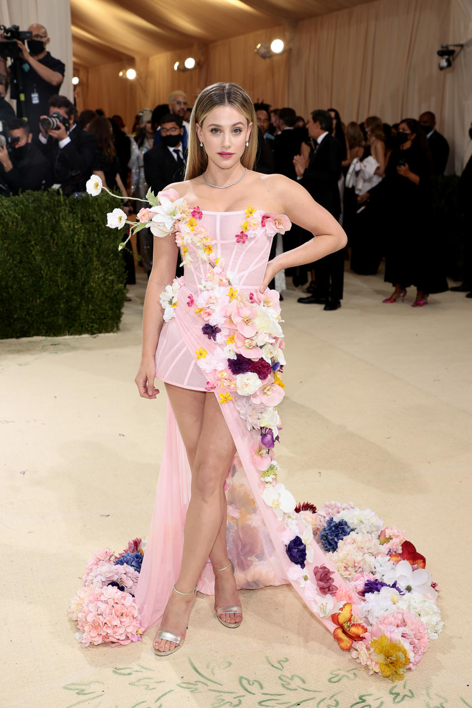 <p> Lili Reinhart&apos;s Christian Siriano gown was a floral dream! The dress was sheer, millennial pink and covered in vibrant flowers, right down to the trailing train. This dress was by far one of the prettiest ever to walk the red carpet. </p>