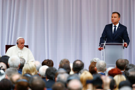 Pope Francis (L) listens to a welcoming ceremony speech by Polish President Andrzej Duda at Wawel Royal Castle in Krakow, Poland July 27, 2016. REUTERS/Stefano Rellandini