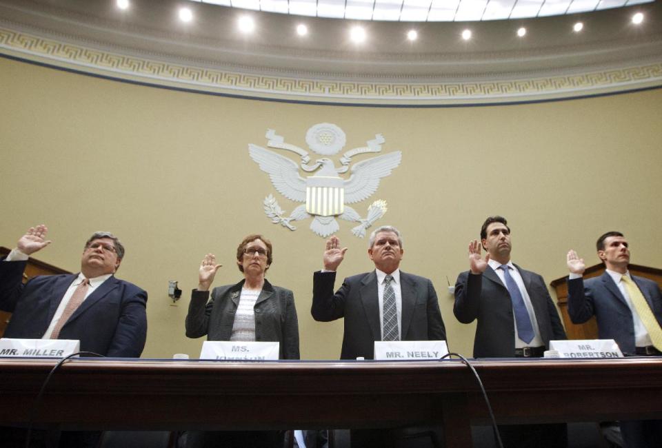 The House Committee on Oversight and Government Reform conducts the first hearing on incidents of wasteful spending by the General Services Administration, the real estate agency for federal buildings, on Capitol Hill in Washington, Monday, April 16, 2012. Being sworn in to testify, from left are, GSA Inspector General Brian Miller, former GSA Administrator Martha Johnson, Jeff Neely, former regional commissioner of the Public Buildings Service, Pacific Rim Region, GSA Chief of Staff Michael Robertson, and David Foley, deputy commissioner of the GSA Public Buildings Service.  (AP Photo/J. Scott Applewhite)