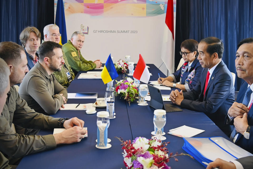 In this photo released by the Press and Media Bureau of the Indonesian Presidential Palace, Indonesian President Joko Widodo, second right, talks with Ukrainian President Volodymyr Zelenskyy, third left, during their bilateral meeting on the sidelines of the G7 Summit in Hiroshima, Japan, Sunday, May 21, 2023. (Laily Rachev/Indonesian Presidential Palace via AP)