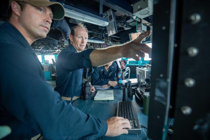 Cmdr. Kevin Schaeffer (right), commanding officer of the Arleigh Burke-class guided-missile destroyer USS Chung-Hoon, and Lt. William Stimson, during a transit through the Taiwan Strait on June 3, 2023.&nbsp; / Credit: U.S. Navy/Mass Communication Specialist 1st Class Andre T. Richard/U.S. 7th Fleet