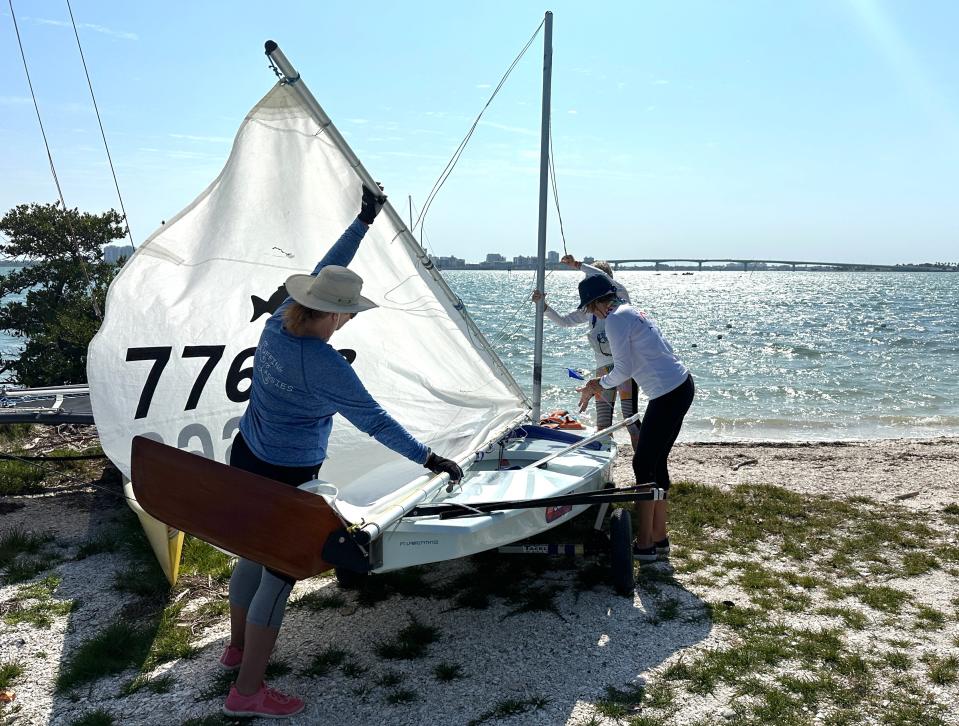 Sailors prep for sailing in the Rainbow Regatta on Wednesday afternoon. High winds caused dangerous conditions in Sarasota Bay on Wednesday and Thursday leading to 75 disappointed solo sailors as this year's event was canceled.